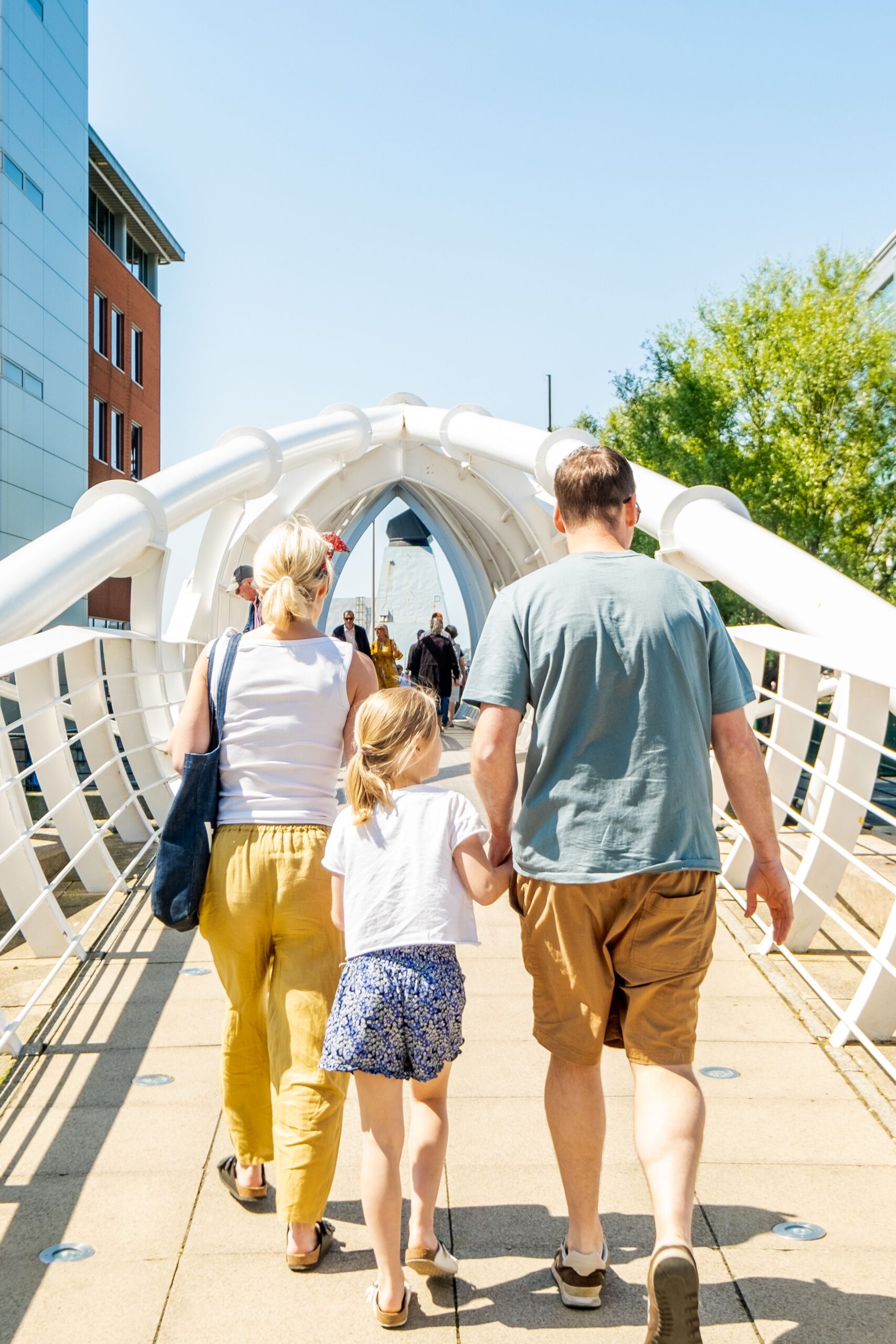 Family walking on the bridge at Liverpool Waters
